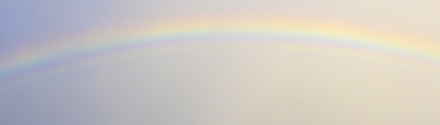 Sofia at the coast photographing a rainbow.