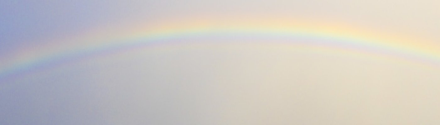 Sofia at the coast photographing a rainbow.